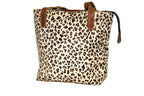Leopard print tote bag with brown leather straps on a white background
